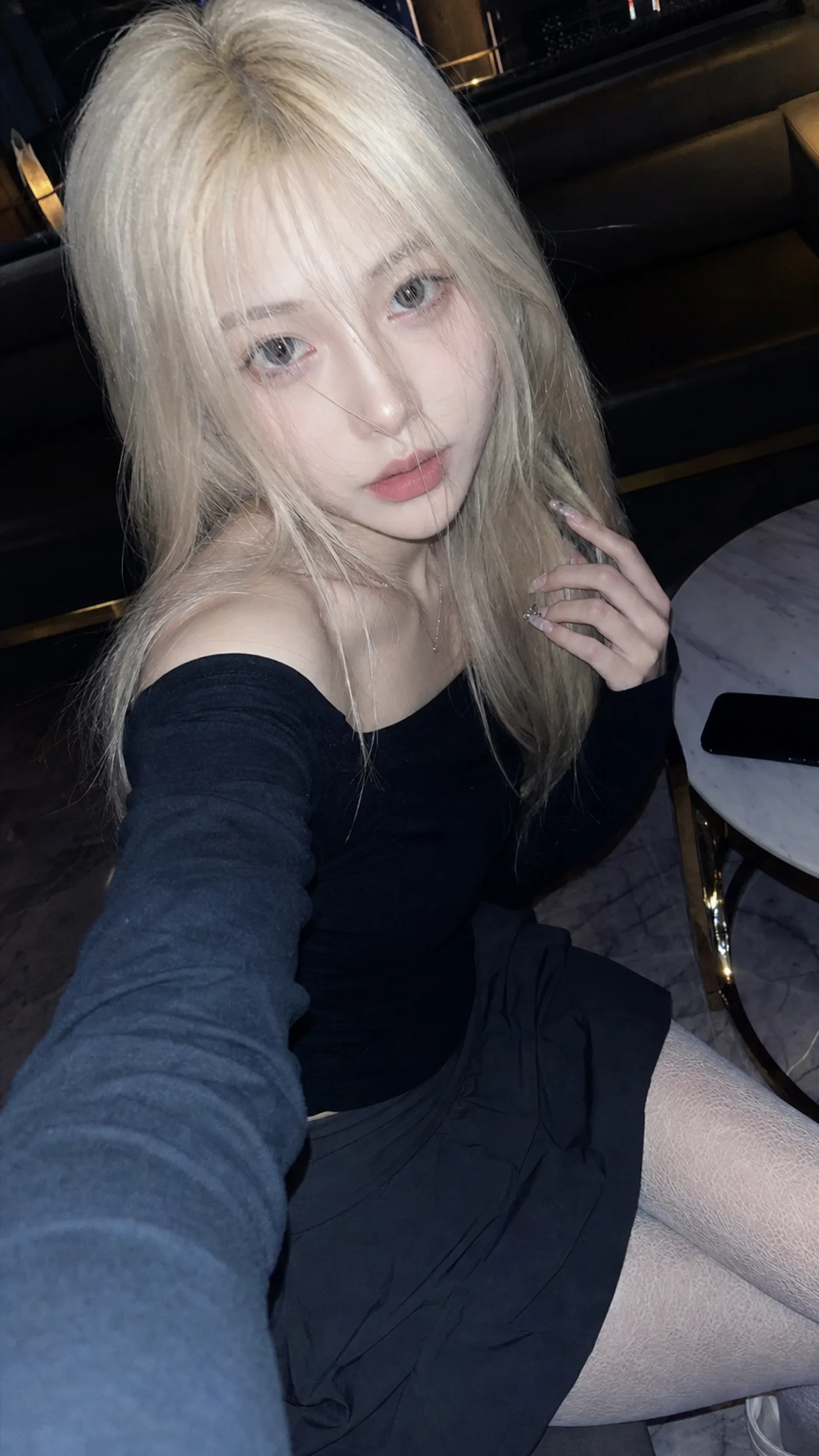 A realistic vertical 9:16 phone selfie, 